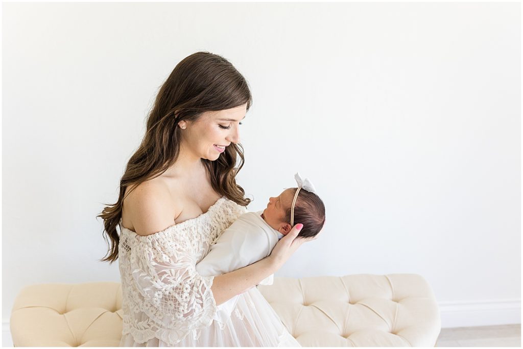 Mother and baby girl sitting in studio Newborn Photos OKC