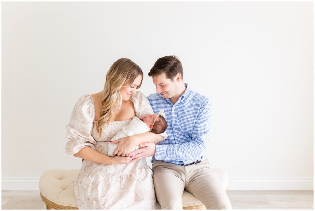 Newborn Photographer Edmond OK Family Sitting with swaddled baby