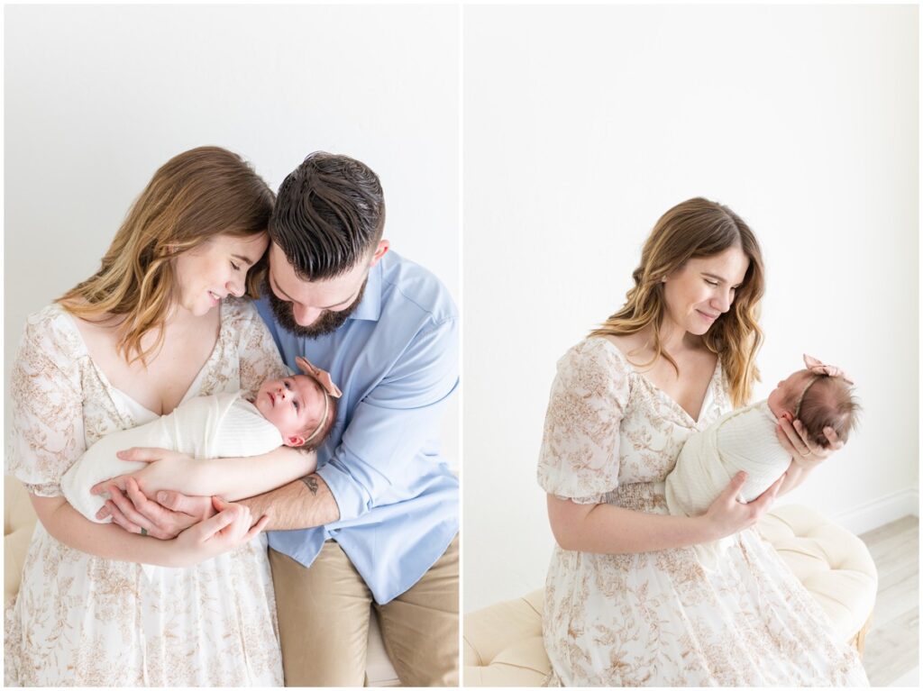 Mom and Dad sitting holding newborn baby girl swaddled 