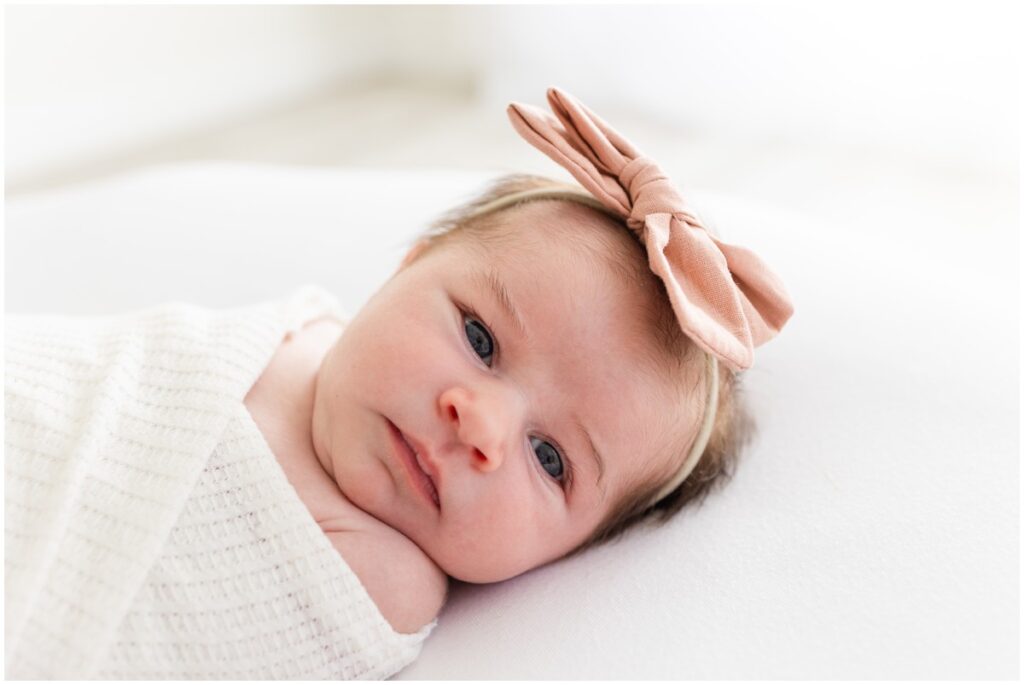Newborn Baby girl swaddled awake 