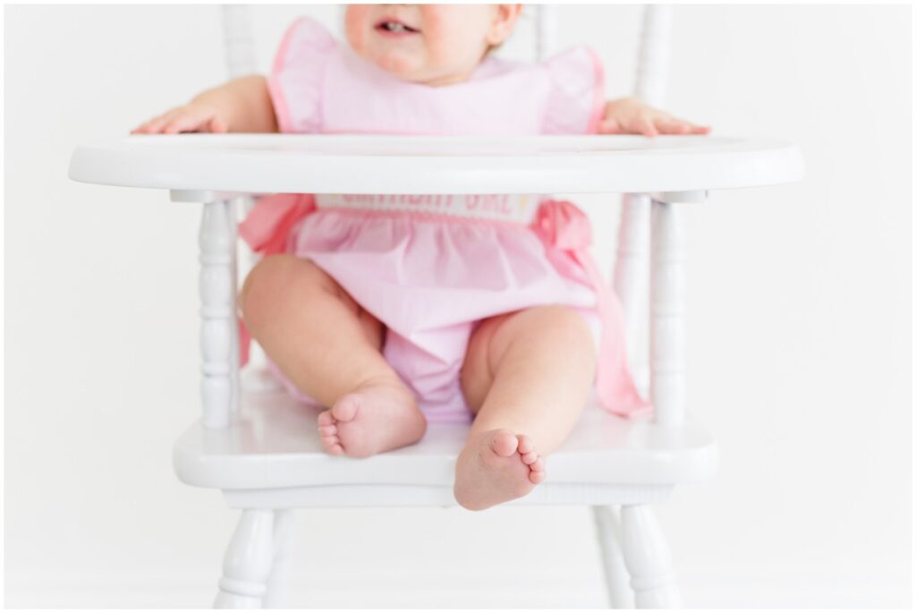One year old photography OKC little baby girl in high chair little toes